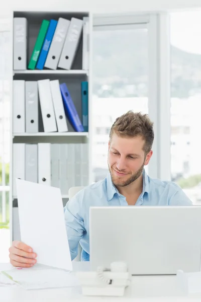 Handsome man working at his desk — Stock Photo, Image