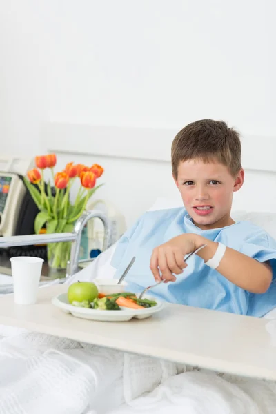 Sick boy having food in hospital — Stock Photo, Image