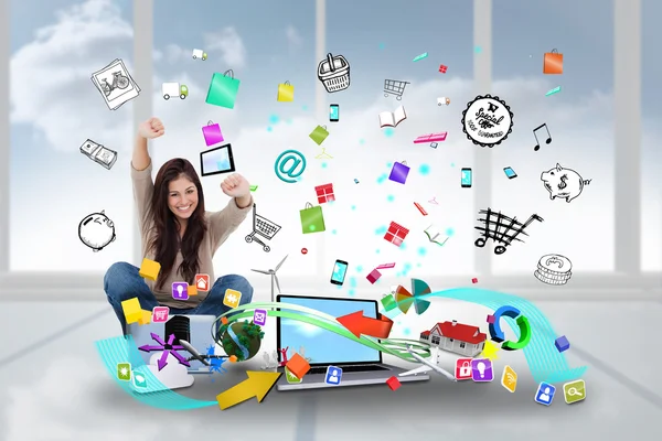 Cheering girl using laptop with app icons — Stock Photo, Image