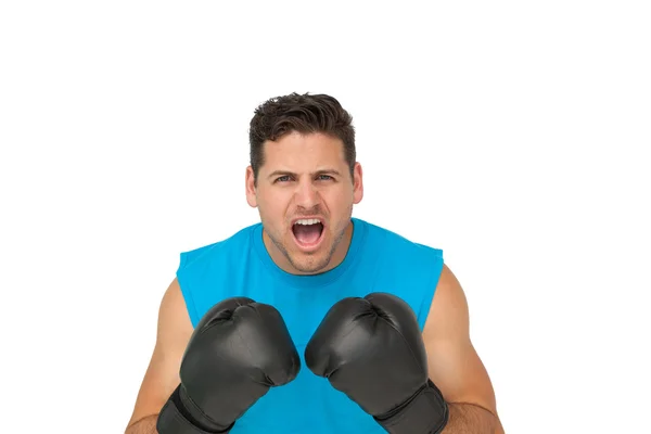 Close-up portrait of a determined male boxer screaming — Stock Photo, Image