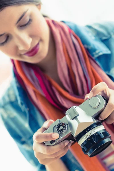 Woman looking at her camera — Stock Photo, Image