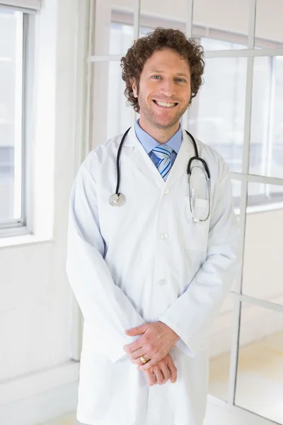 Happy handsome male doctor in hospital — Stock Photo, Image