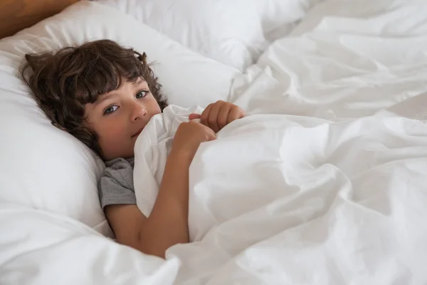 Boy resting in bed — Stock Photo, Image