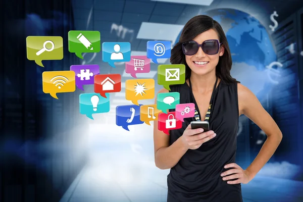 Glamorous brunette using smartphone with app icons Stock Picture