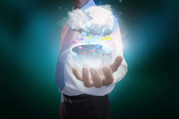 Businessman presenting earth with cloud and app icons — Stock Photo, Image