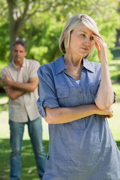 Upset couple in park — Stock Photo, Image