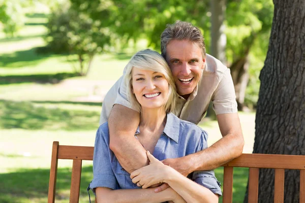 Man embracing woman from behind — Stock Photo, Image