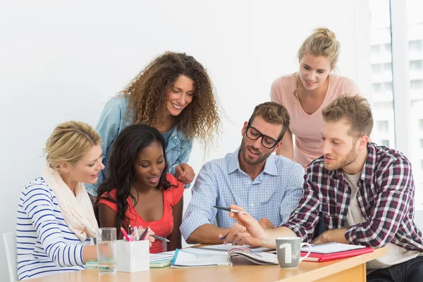 Team of young designers having a meeting — Stock Photo, Image