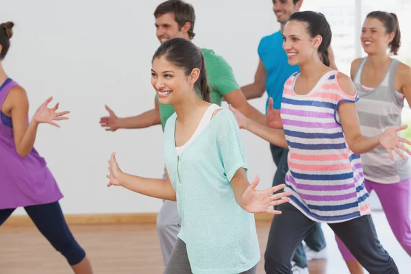 Cheerful fitness class and instructor doing pilates — Stock Photo, Image