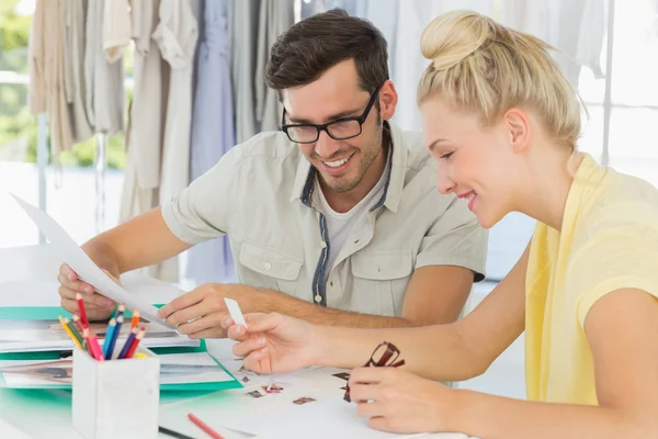 Fashion designers discussing designs — Stock Photo, Image