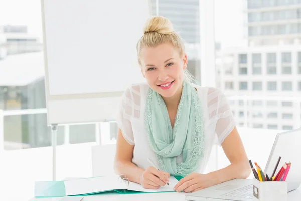 Portrait of a casual young woman with catalog — Stock Photo, Image