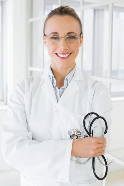 Smiling female doctor with stethoscope in hospital — Stock Photo, Image