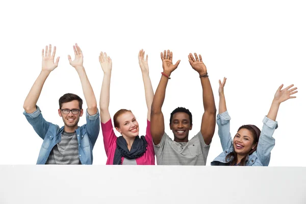 Young friends raising hands — Stock Photo, Image