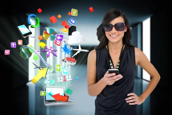 Brunette using smartphone with app icons and laptop — Stock Photo, Image