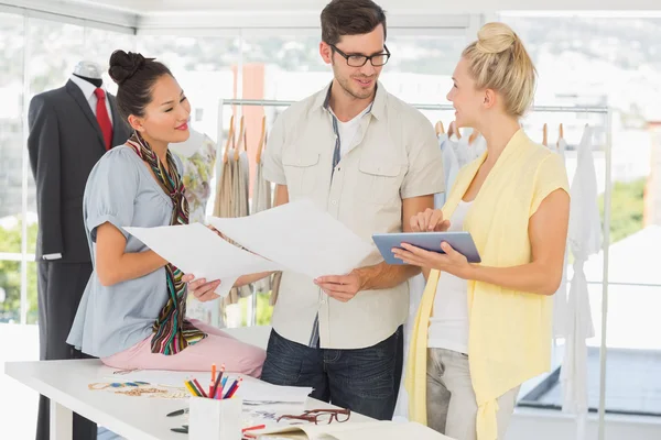 Fashion designers discussing designs — Stock Photo, Image