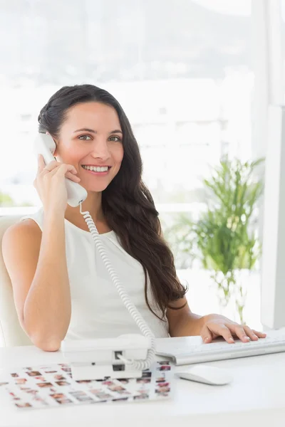 Beautiful editor on telephone — Stock Photo, Image