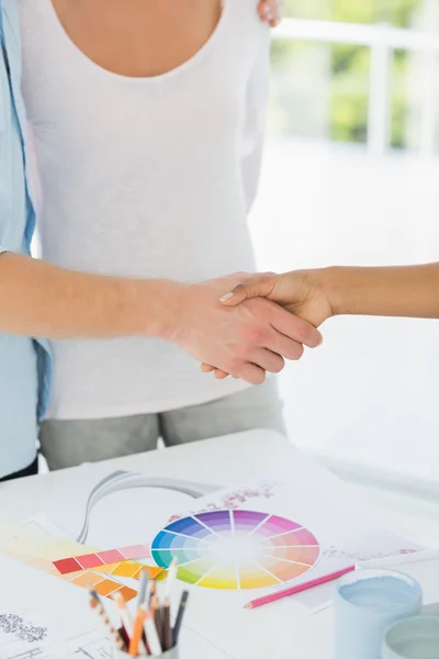 Interior designer shaking the hand of customer — Stock Photo, Image