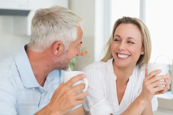 Happy couple having coffee together — Stock Photo, Image