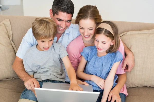 Family using laptop together