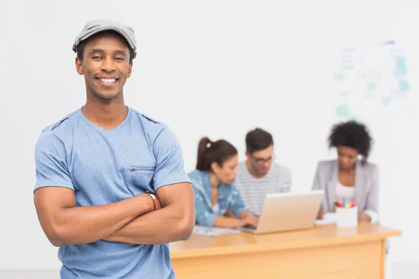 Casual male artist with colleagues — Stock Photo, Image