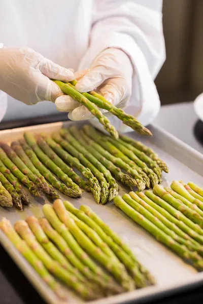 Hands with fresh asparagus — Stock Photo, Image