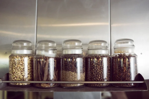 Assorted spices in bottles — Stock Photo, Image