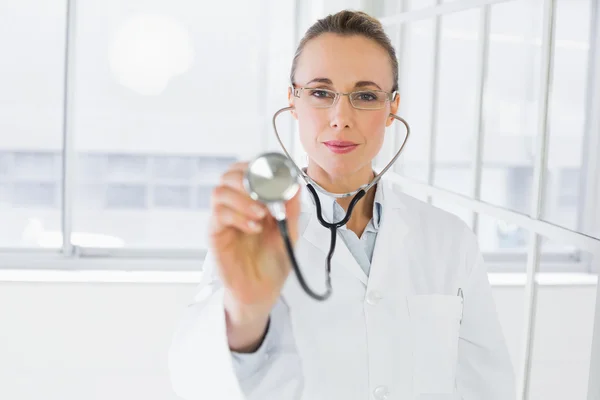 Female doctor with stethoscope in hospital — Stock Photo, Image