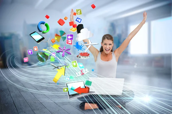 Cheering blonde using laptop with app icons — Stock Photo, Image