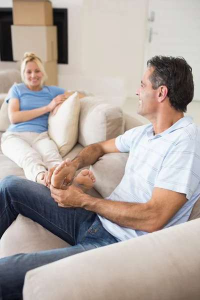 Relaxed couple sitting on sofa — Stock Photo, Image