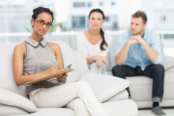 Serious therapist and unhappy couple — Stock Photo, Image