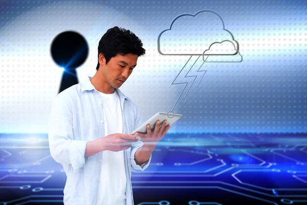 Casual man using tablet with cloud graphic — Stock Photo, Image