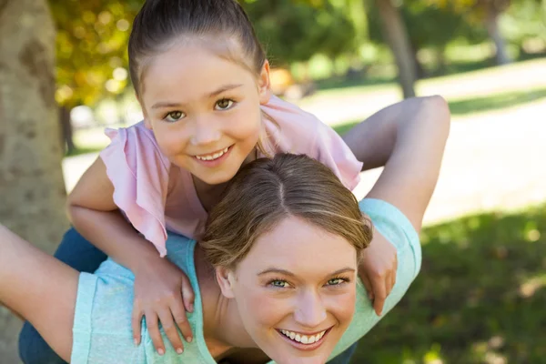 Happy mother and daughter at park — Stock Photo, Image