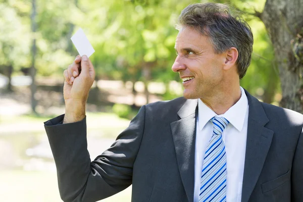 Businessman holding business card — Stock Photo, Image