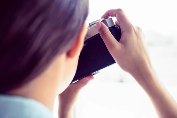 Brunette taking a photograph — Stock Photo, Image