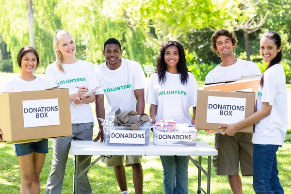 Volunteers with donation boxes — Stock Photo, Image