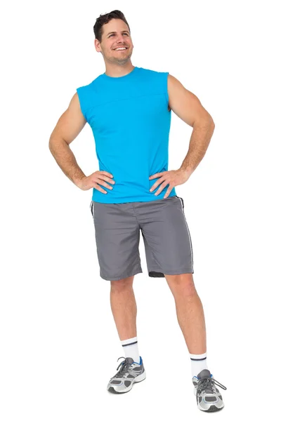 Full length portrait of a fit young man smiling — Stock Photo, Image