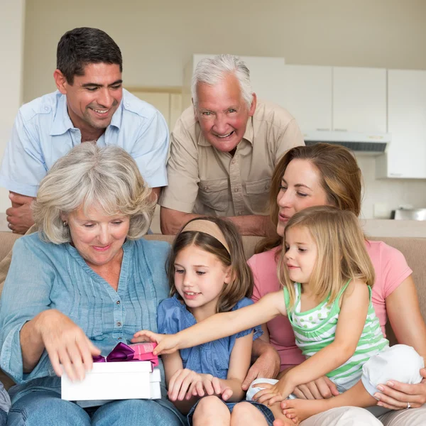 Family with gifts in sitting room — Stock Photo, Image