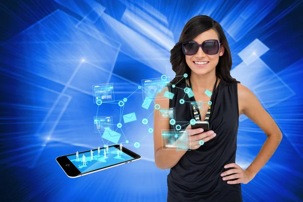 Glamorous brunette using smartphone with email symbols — Stock Photo, Image