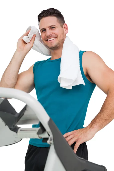 Young man running on a treadmill — Stock Photo, Image