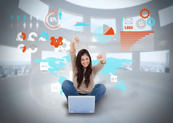 Cheering girl using laptop with interface — Stock Photo, Image