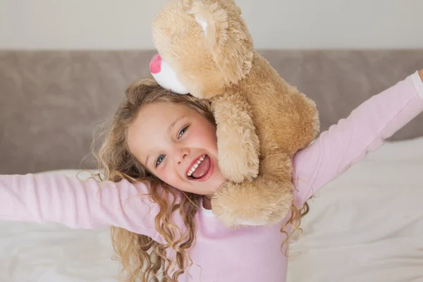 Young happy girl with stuffed toy — Stock Photo, Image