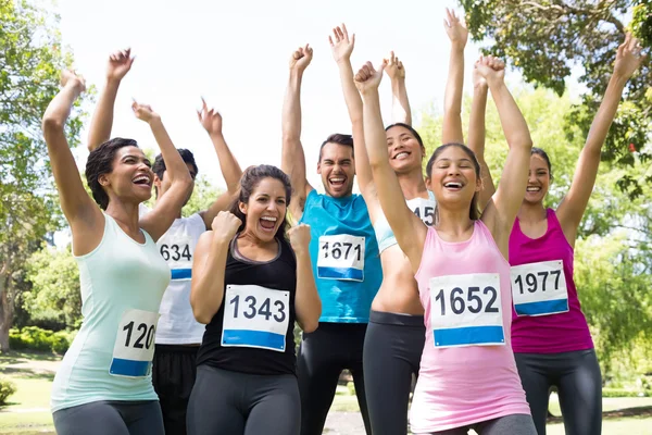 Friends cheering after winning a race — Stock Photo, Image