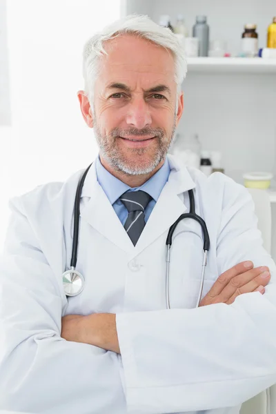 Portrait of a smiling male doctor at medical office — Stock Photo, Image