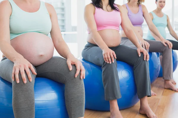 Pregnant women sitting on exercise balls — Stock Photo, Image