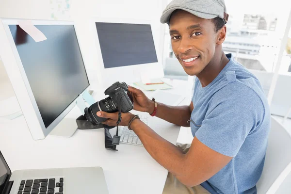 Male photo editor with digital camera in office — Stock Photo, Image