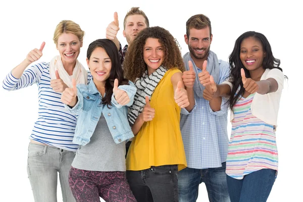 Happy group of young friends giving thumbs up to camera — Stock Photo, Image