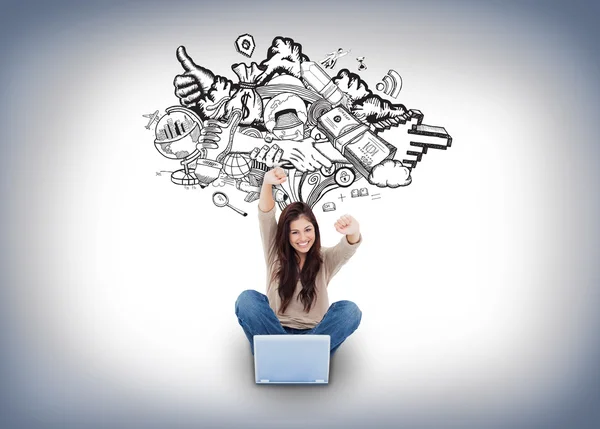 Cheering girl using laptop with doodles — Stock Photo, Image