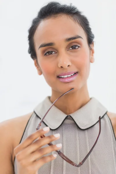 Pretty woman holding her glasses — Stock Photo, Image