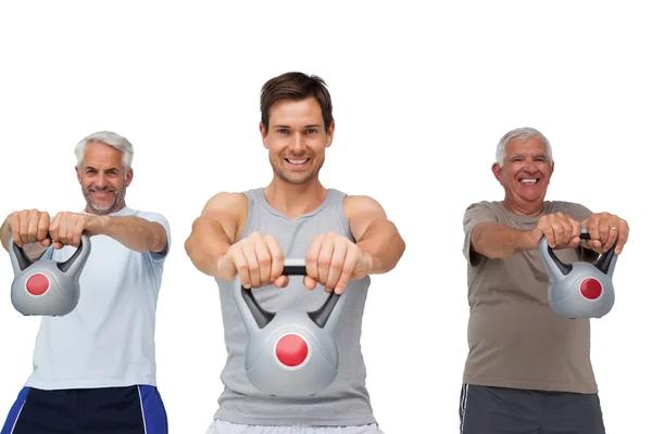 Mannen uitoefenend met waterkoker klokken — Stockfoto