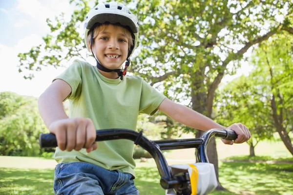 Boy riding bicycle at park — Stock Photo, Image